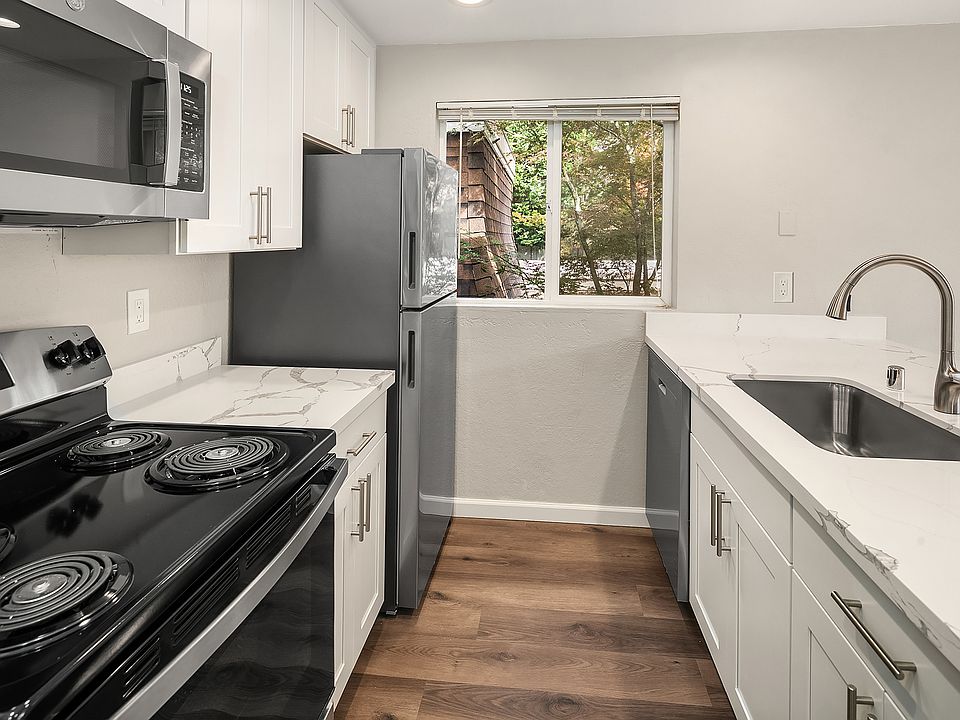 STAINLESS STEEL FRIDGE/FREEZER, DISHWASHER, AND RANGE