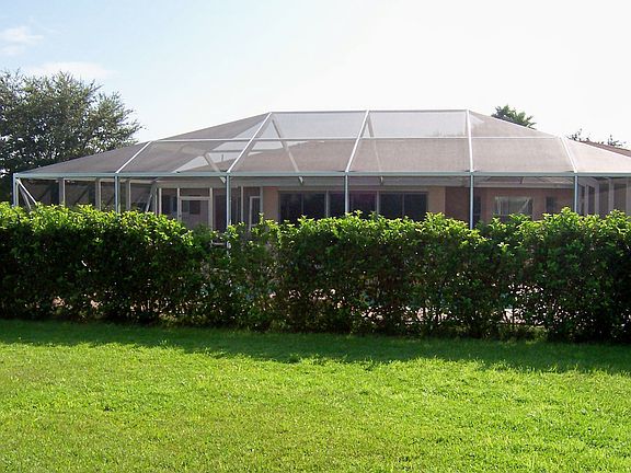 BACK OF HOME WITH POOL