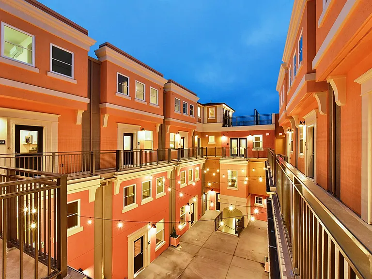 Stacked townhouses recreate a peaceful Mediterranean Courtyard in the heart of the City.