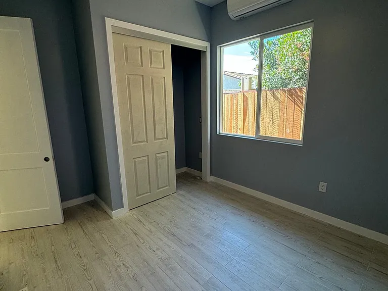 Bedrooms each have minisplit and closet. Ceiling fan changes light colors. 10' ceilings.