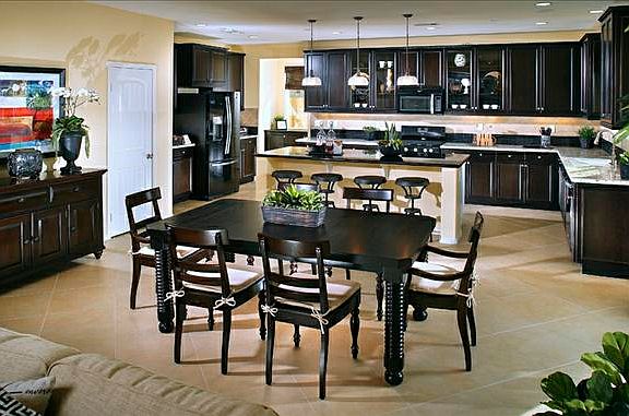 Dining room open to kitchen with dark stain cabinetry