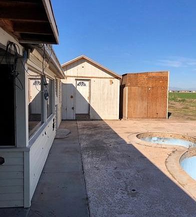 STORAGE SHEDS NW OF HOUSE