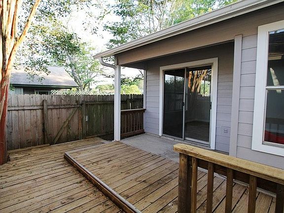 Side deck with sliding doors into large open concept main li