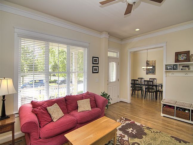 Glowing hardwoods in this beautiful living room with lots of natural light!