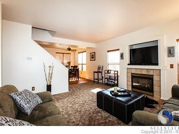 Living room with newer carpet and fireplace