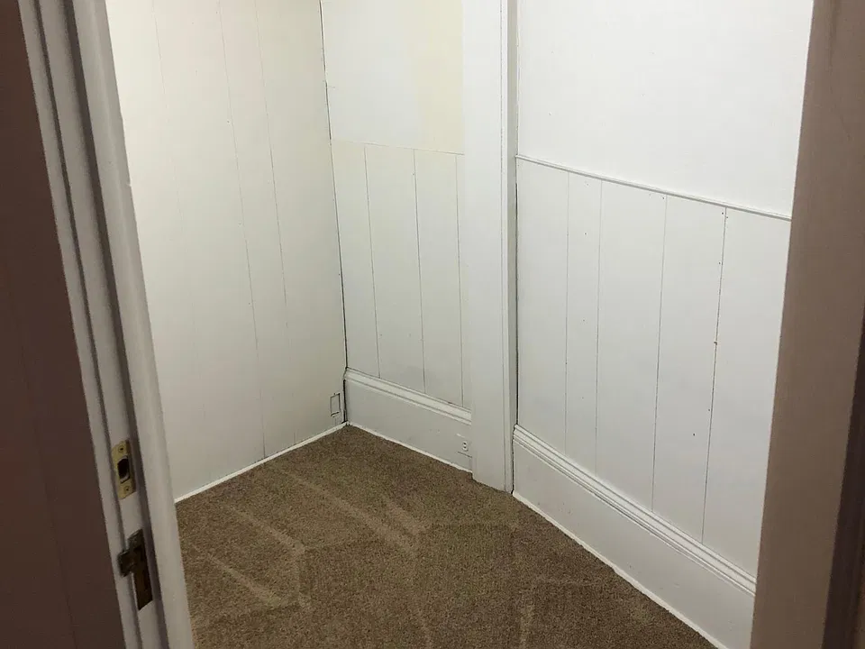 large walk in closet area that can also accommodate a dresser or additional rolling rack