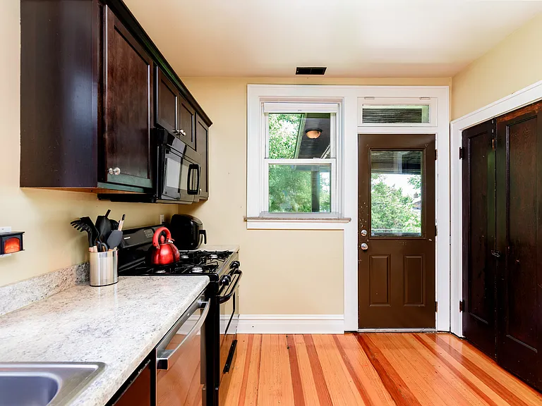 Kitchen with dishwasher range pantry and door back balcony