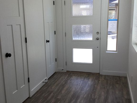 Bright entry with coat closet and powder room