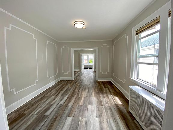 Spacious sunlit apartment w/ beautiful white accents, new floors, new LED lighting