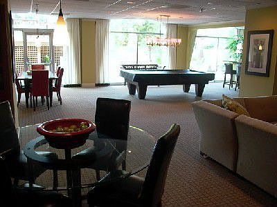 Mezzanine Level clubhouse room with Billiards and flat screen tv