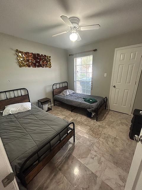 Spacious private room with desk spaceideal for remote work. Beds can be combined. Shared full bathroom nearby.