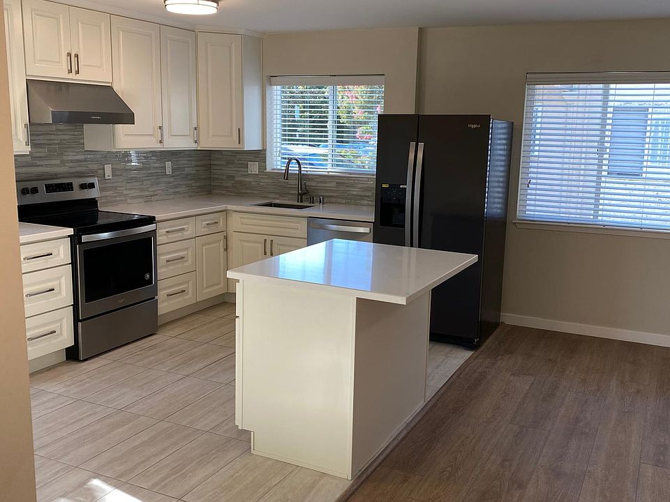 Kitchen with island with seating for two