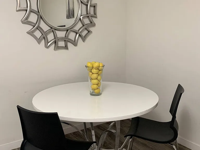 Cozy dining table for two with forever fresh lemons decoration.