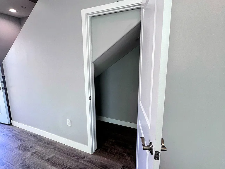 Under the stairway closet.