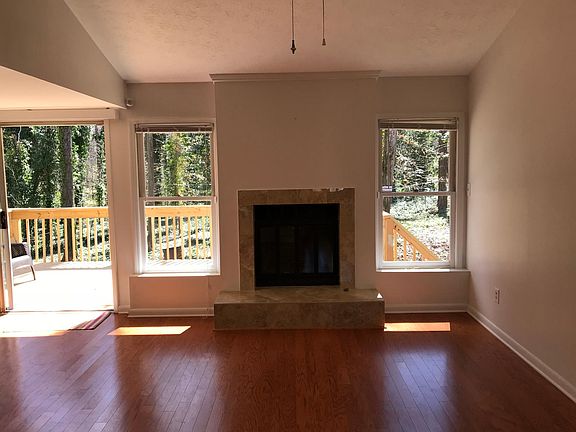 Fireplace in living room with a great view to the quiet and beautiful backyard