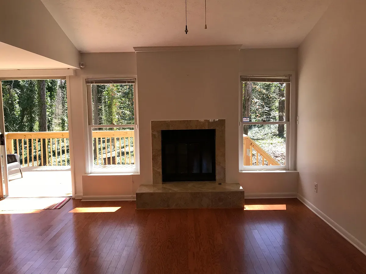 Fireplace in living room with a great view to the quiet and beautiful backyard, and a big backyard deck. - 3456 Brookview Dr