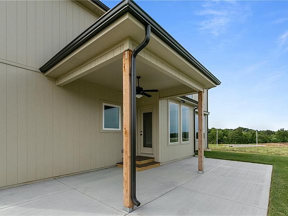 The patio is accessed from the dining area and the window overlooking the patio is above the kitche