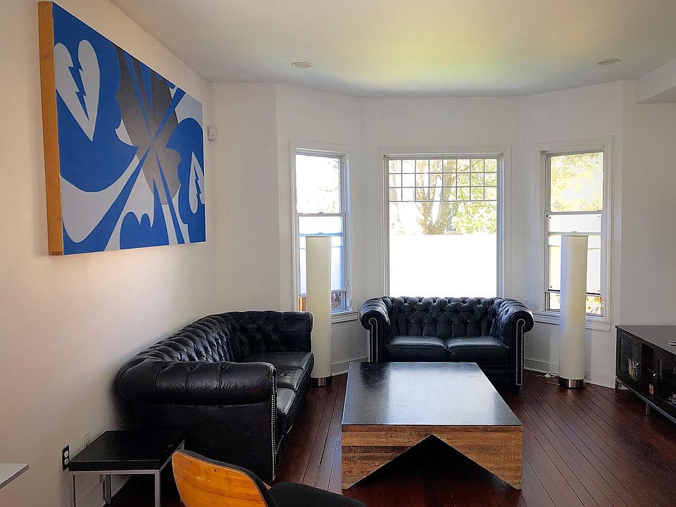 Spacious open plan living room with lots of sunlight.
