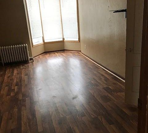 Large bedroom with walk in closet and bay window