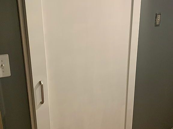 barn door to one bathroom