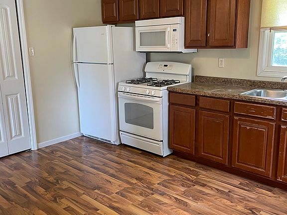 Kitchen with washer and dryer hookup.