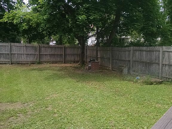 Large Fenced In Back Yard with Grill