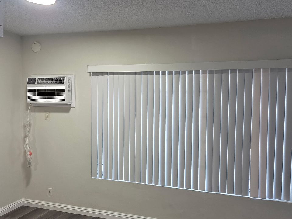 living room with huge window. 2 in1 Unit AC and heater unit