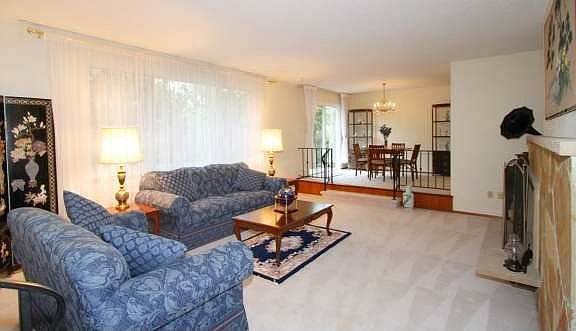 From the living room to the dining room. The big picture window overlooks the private backyard ( a l