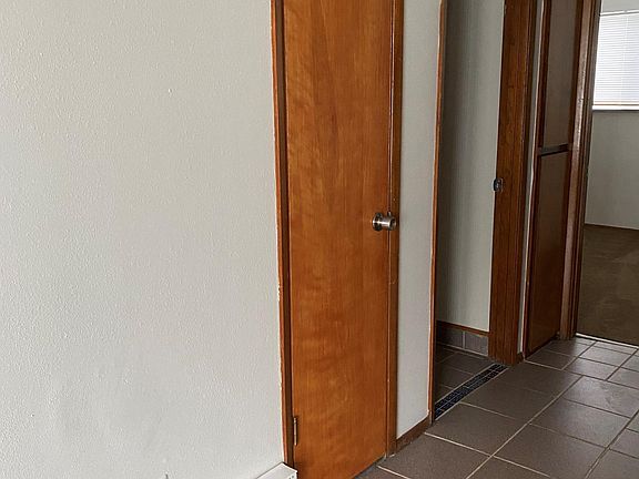 Hallway with closet and storage