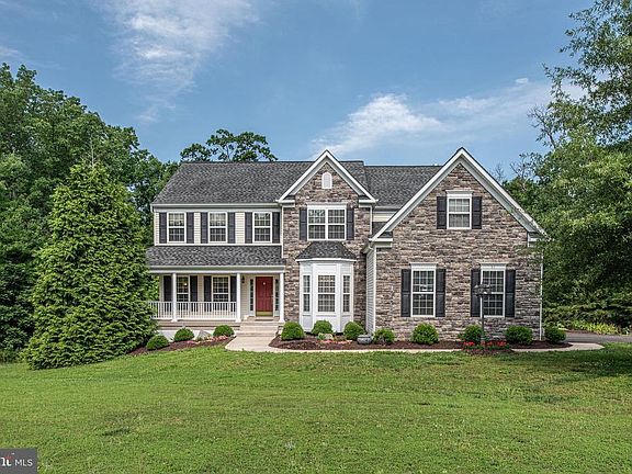 Beautiful setting on 3 acres adjacent to river.
