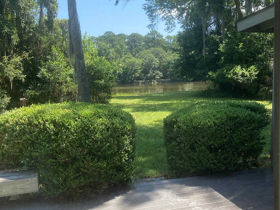 Back deck looking out to water and Sea Pines Forest Preserve