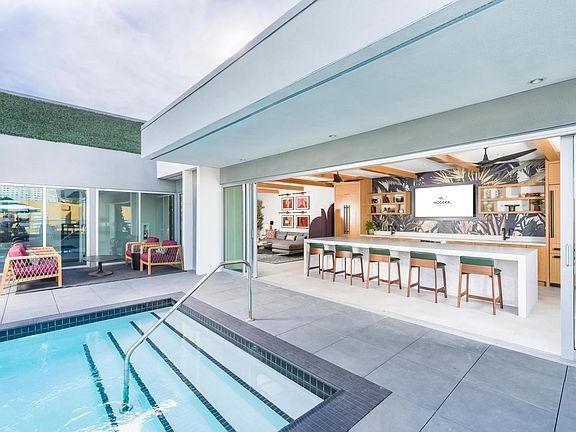 Enjoy poolside drinks and views at our resort-style rooftop with an outdoor bar.