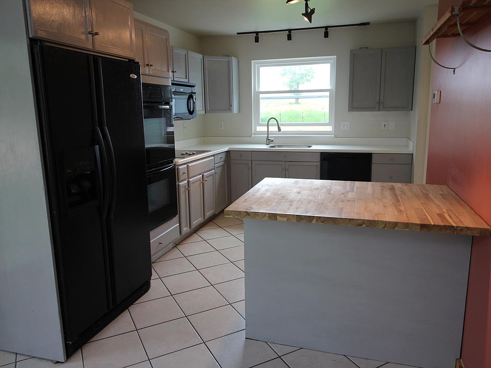 Kitchen with island and overhang