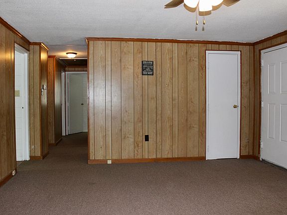 Living Room with Wood Panel Walls