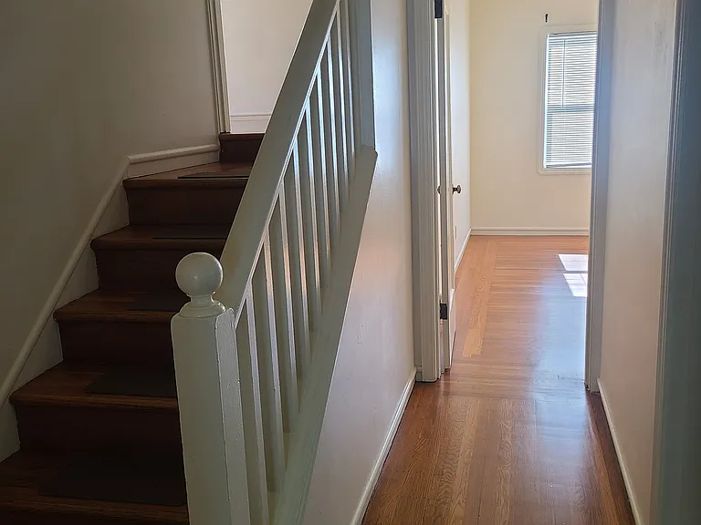 steps to the upper bedroom , entrance to the first floor bedroom