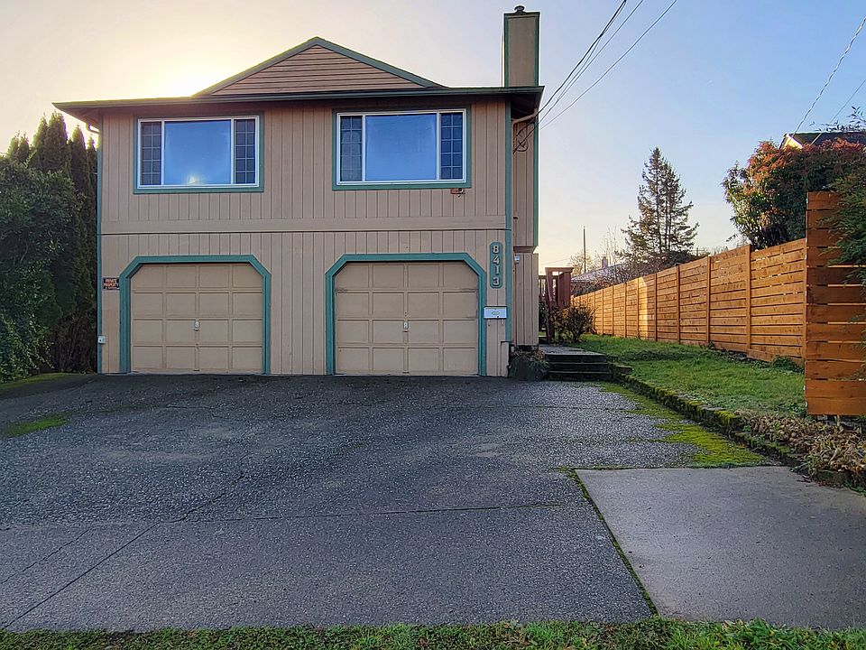 2 car garage with enough space to fit 4 cars in front.