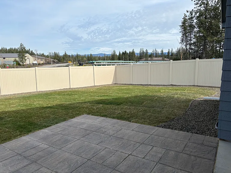 Right side of back yard with patio