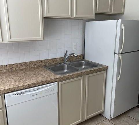 New dishwasher, new kitchen faucet, refrigerator and newly painted cabinets.