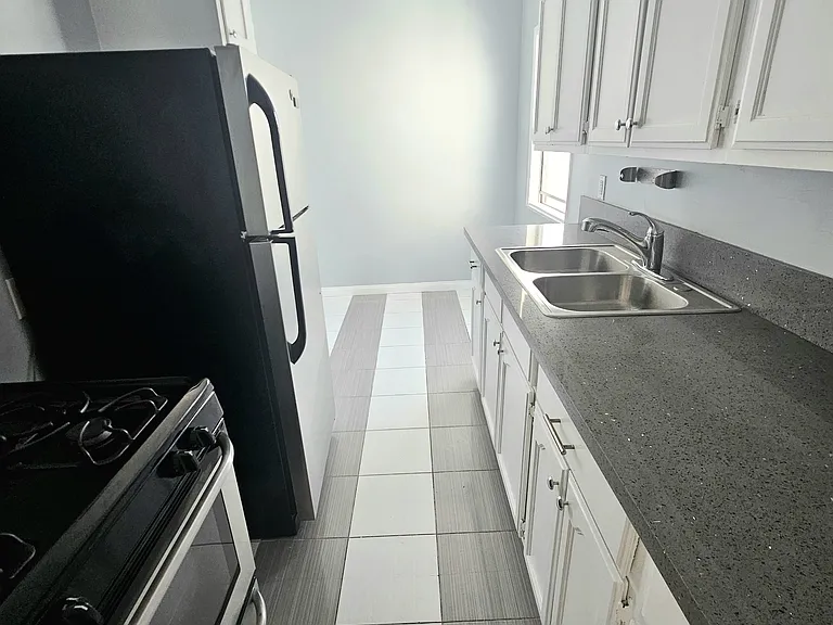 Kitchen with space for table next to window or move fridge and have more space for cooking by adding a nice island.