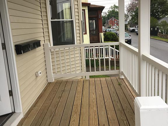 Shared front porch. I am purchasing chairs.