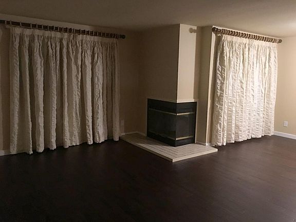 Living room/dining room with two newish sliding glass doors