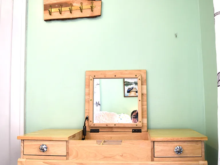 Can be a vanity - the mirror closes down to be an office desk