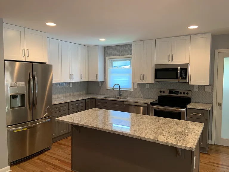 Updated, modern, and cabinets and drawers are soft close.