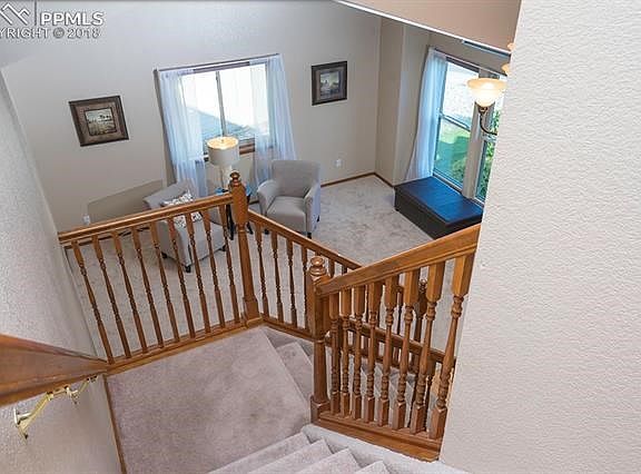 View of living room from upper landing of staircase. Prom, anyone?