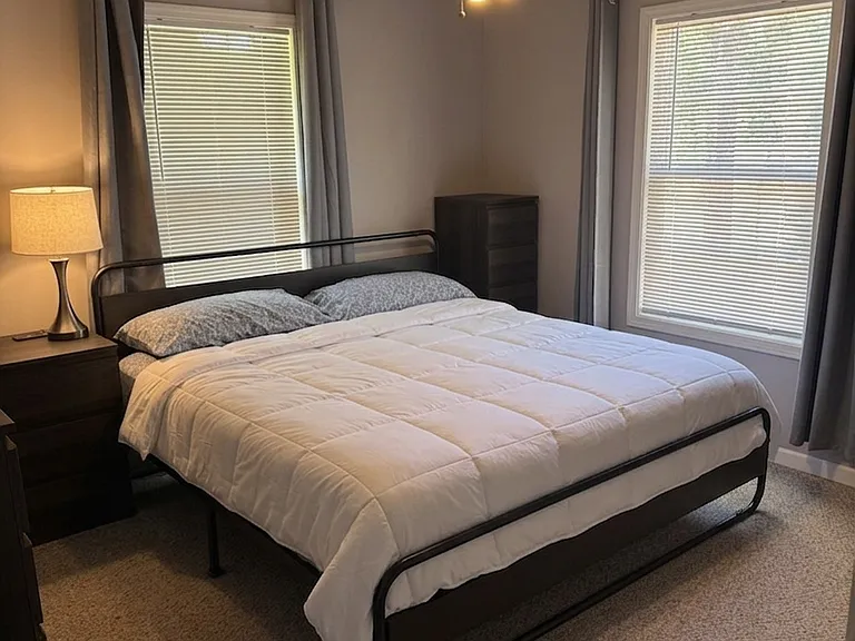 Master Bedroom
Spacious primary suite featuring comfortable furnishings, ample natural light, and a relaxing atmosphere with full attached bathroom.