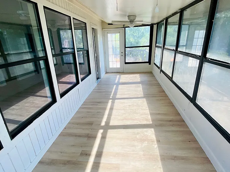 Enclosed porch overlooking lake