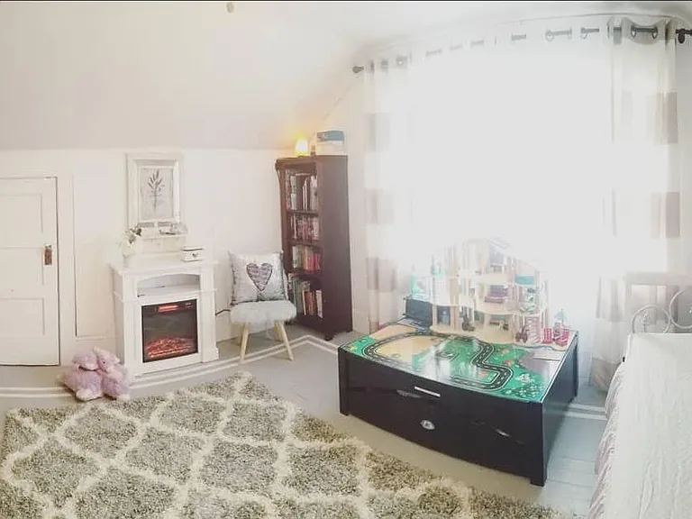 One of two large upstairs bedrooms. Large enough to fit a triple bunk bed for fun sleepovers with room for play space, a desk, dressers, etc. So many possibilities either for small kids or a teen room, large upstairs office, etc.