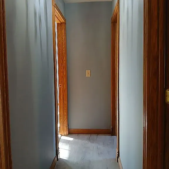 Hall going to 3 bedrooms and a bathroom.
