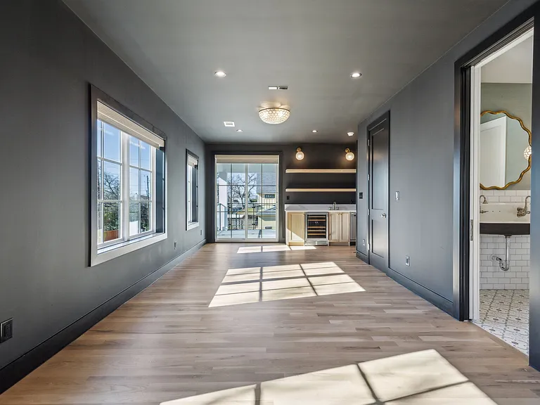 Entertainment/bonus room with connected outdoor patio and wet bar!