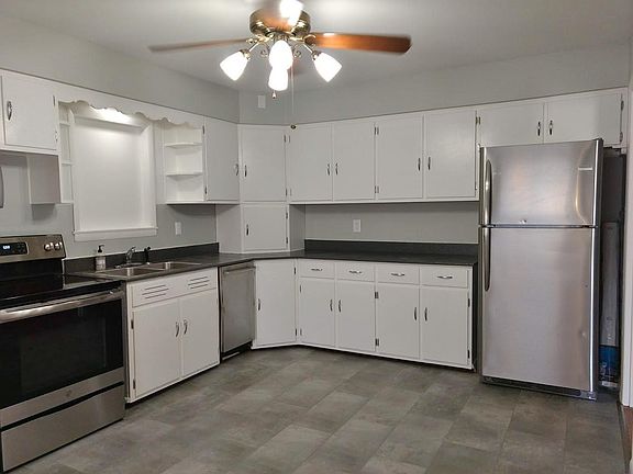 Kitchen with stainless appliances including dishwasher.